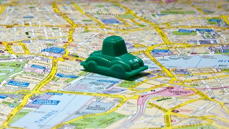 Small car on the map of Londonの写真素材