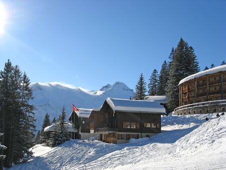 Winter holiday house in swiss alpsの写真素材