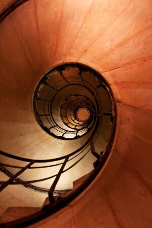 Spiral staircase and stone steps in old tower