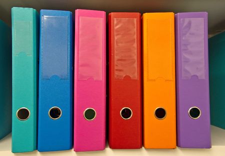 Colorful binders on the shelf