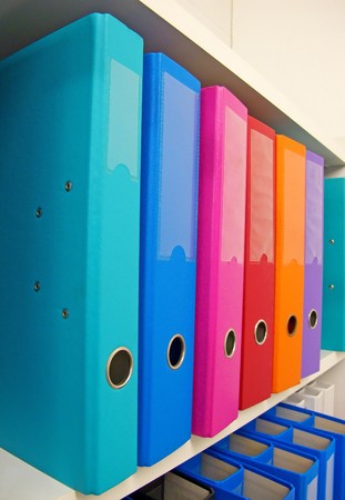 Colorful office folders on the bookshelfの写真素材