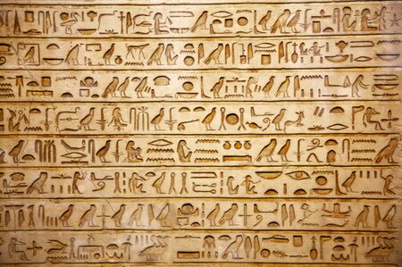 old egypt hieroglyphs carved on the stone