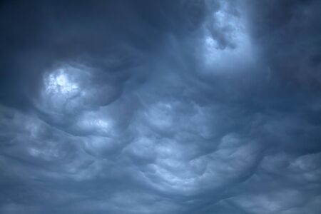 Dark, Ominous Rain Clouds before the thunder stormの写真素材
