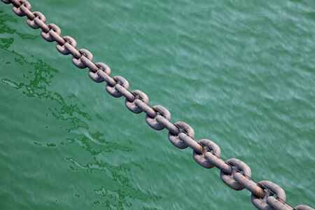 Huge old rusty anchor chain of the battleship