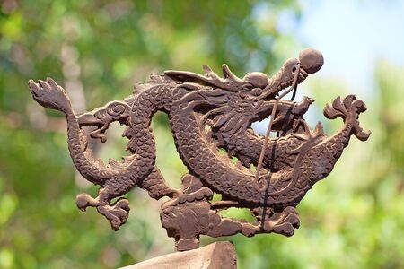 Bronze dragon on the incense pot in Po Lin monastery on Lantau Island (Hong Kong)の写真素材