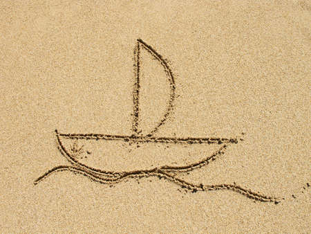 simple drawing in the sand on the beachの写真素材