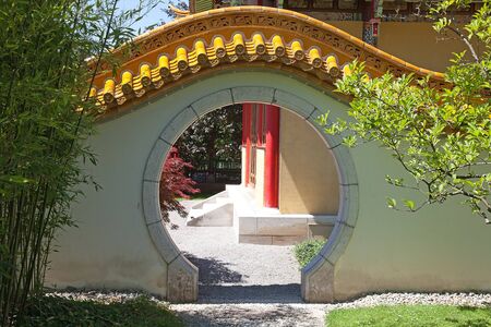 Traditional chinese garden. entrance with round gateの写真素材