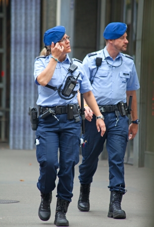 ZURICH - AUGUST 1: Zurich police patrouling the streets during Swiss National Day parade on August 1, 2009 in Zurich, Switzerland.のeditorial素材