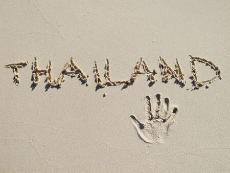 simple "thailand" drawing on the sand on the beachの写真素材