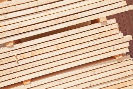 Stack of new wooden studs at the lumber yard