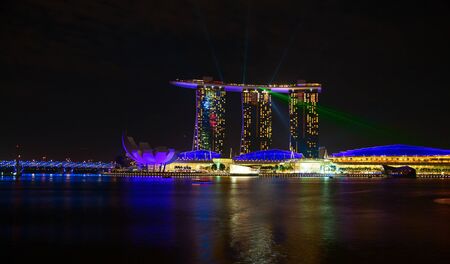 SINGAPORE - FEBRUARY 5: The Marina Bay Sands complex at night on February 5, 2012 in Singapore. Marina Bay Sands is an integrated resort and billed as the world's most expensive standalone casino property.のeditorial素材