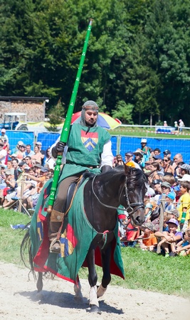 AGASUL - AUGUST 18: Knight on the horse taking part in tournament reconstruction near Kyburg castle on August 18, 2012 in Agasul, Canton Zurich, Switzerland. のeditorial素材