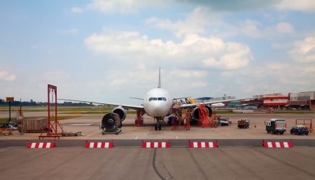 SINGAPORE - FEBRUARY 22:Airbus A320 on the repair site with engine ready for replacement on February 22, 2012 in Singapore. Singapore Changi is major hub in South East Asiaのeditorial素材