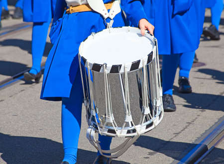 Drum in the hands of the musician on the street paradeの写真素材