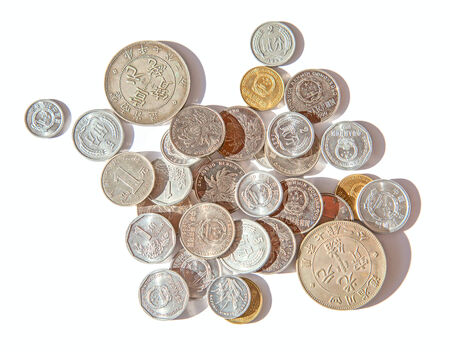 Ancient chinese silver coins isolated on whiteの写真素材