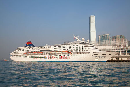 HONG KONG - DECEMBER 3: Cruise liner "Star Aquarius" at Kowloon pier on December 3, 2010 in Hong Kong, China. Hong Kong is ine of the most popular destinations in the world with ove 40 millions visitors/year.のeditorial素材