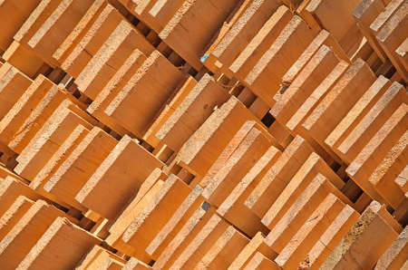 Stack of new wooden studs at the lumber yardの写真素材