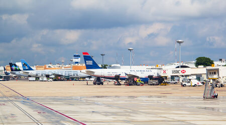 CANCUN - OCTOBER 19: Airplanes disembarking passengers after arriving to Cancun on October 19, 2014 in Cancun, Mexico. Cancun is the biggest international airport in Mexicoのeditorial素材