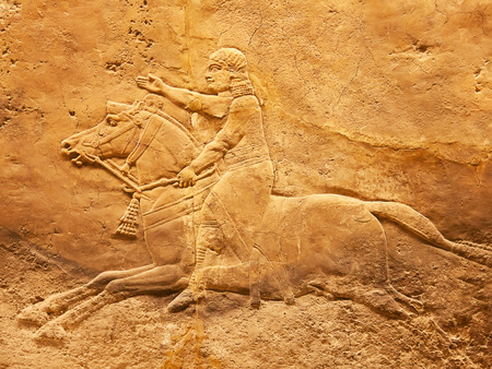 Ancient sumerian stone carving with cuneiform scripting