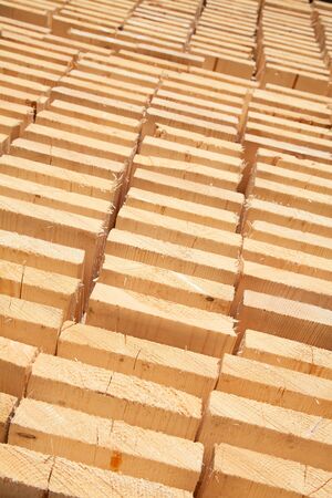 Stack of new wooden studs at the lumber yardの写真素材