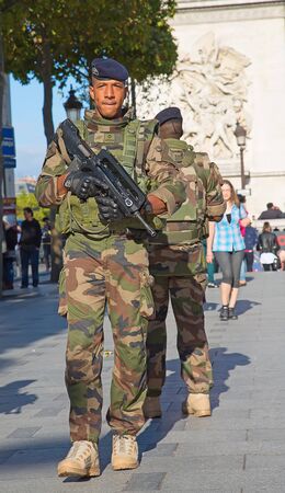 PARIS, FRANCE-SEPTEMER.20,2015: French soldier in uniform near Arc de Triomphe on September 20, 2015...