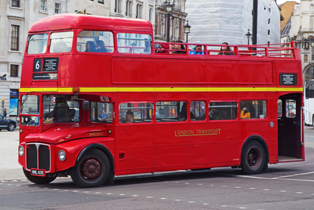 LONDON - APRIL 17: Red Double Decker Bus on the Canon street in London on April 17, 2016 in London, UK. These dobledecker bus is one of the most iconic symbol of London.のeditorial素材