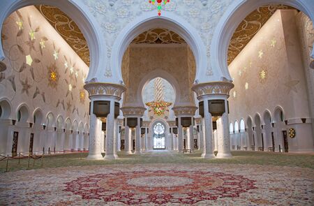 ABU DHABI, UAE - APRIL 23, 2014: Interior of Sheikh Zayed Mosque in Abu Dhabi. Mosque designed by Yusef Abdelki and opened in 2007.のeditorial素材