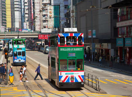 HONG KONG - APRIL 02: Unidentified people using tram in Hong Kong on April 02, 2017. Hong Kong tram is the only in the world run with double deckers and one of the main tourist attractions.のeditorial素材