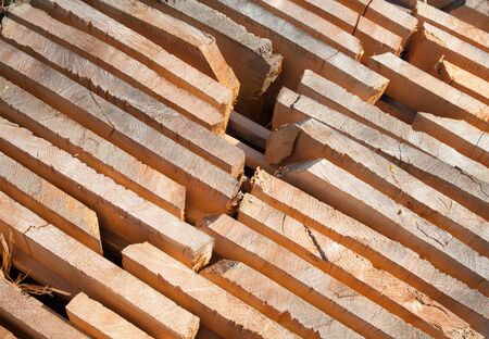 Stack of new wooden studs at the lumber yard