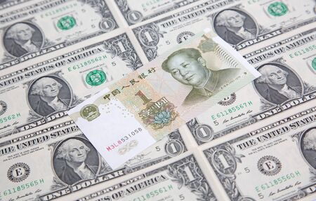US 1 dollar banknote covered by chinese yuanの写真素材