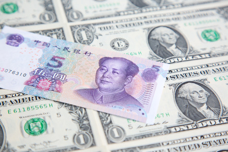 US 1 dollar banknote covered by chinese yuanの写真素材