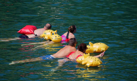 ZURICH - AUGUST 28: "Zurcher Limmatschwimmen" (swimming in the Limmat river via Zurich city center) on August 27, 2017 in Zurich, Switzerland. The "Limmatschwimmen" is yearly event popular among locals and tourists.のeditorial素材