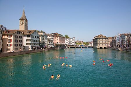 ZURICH - AUGUST 28: "Zurcher Limmatschwimmen" (swimming in the Limmat river via Zurich city center) on August 27, 2017 in Zurich, Switzerland. The "Limmatschwimmen" is yearly event popular among locals and tourists.のeditorial素材