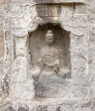 Famous Longmen Grottoes (statues of Buddha and Bodhisattvas carved in the monolith rock near Luoyang in Hennn province, China)の写真素材