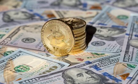 Bitcoins on the US dollar background