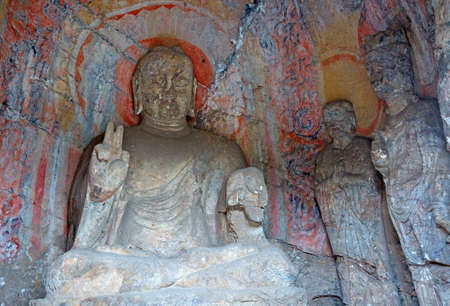Famous Longmen Grottoes (statues of Buddha and Bodhisattvas carved in the monolith rock near Luoyang...