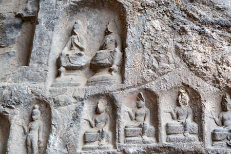 Famous Longmen Grottoes (statues of Buddha and Bodhisattvas carved in the monolith rock near Luoyang in Hennn province, China)の写真素材