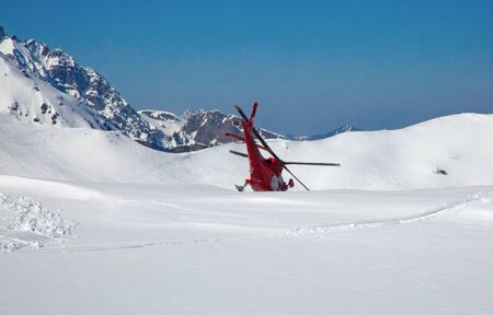 FLUMSERBERG - MARCH 25: The unidentified pilots of the swiss emergency service Rega performing training exercise in skiing area Flumserberg, Switzerland on March 25, 2018. のeditorial素材