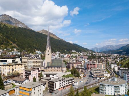 Aerial view of Davos city and lake. Davos is swiss city, famous location of annual meetings of World Economic Forum.の写真素材