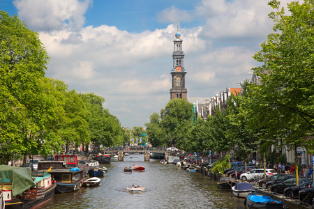 AMSTERDAM - JULY 10: Canals of the Amsterdam city on July 10, 2016 in Amsterdam, Netherlands. The historical canals of the city surrounded by traditional dutch houses is one of the main attractions of Amsterdam.のeditorial素材