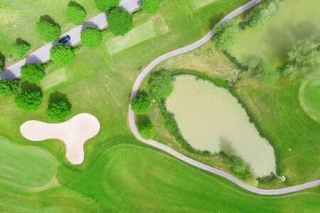 Aerial view of the green grass of the golf courseの写真素材