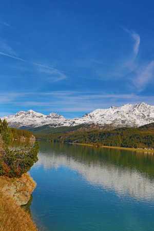 Maloja region - collection of beatiful lakes, mountains and road connecting Switzerland and Italyのeditorial素材