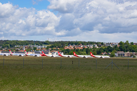 DUEBENDORF - May 24:  Swiss airlines grounding the airplanes on the military airfield Duebrndorf. Due to Coronavirus (COVID-19) outbreak airlines are forced to cancel most of the flights and build measures on keeping current fleet.のeditorial素材