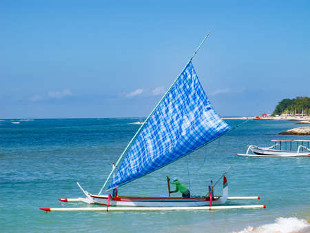 Traditional balinese dragonfly boat on the beach