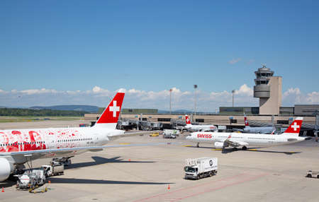 ZURICH - July 30:  Planes preparing for take off at Terminal A of Zurich Airport on July 30, 2016 in Zurich, Switzerland. Zurich airport is home port for Swiss Air and one of the european hubs.のeditorial素材