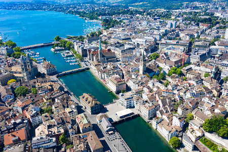 Aerial view of Limmat river and famous Zurich churches. Zurich is important financial center of Switzerland and lovely historical city.の写真素材