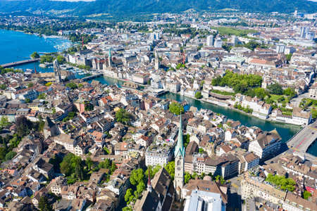 Aerial view of Limmat river and famous Zurich churches. Zurich is important financial center of Switzerland and lovely historical city.の写真素材