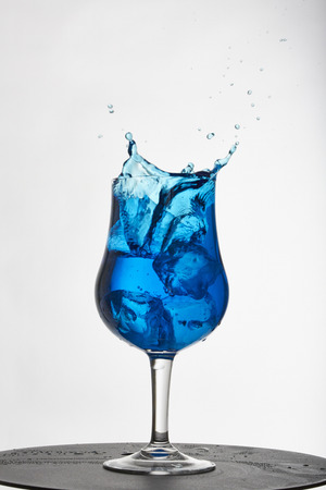 Water splash with ice cubeの写真素材