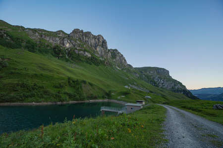 Sunrise and daytime at lake Waldisee Muotathal Schwyz in Switzerland. Sunny summer