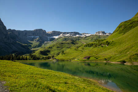 Sunrise and daytime at lake Waldisee Muotathal Schwyz in Switzerland. Sunny summerの写真素材